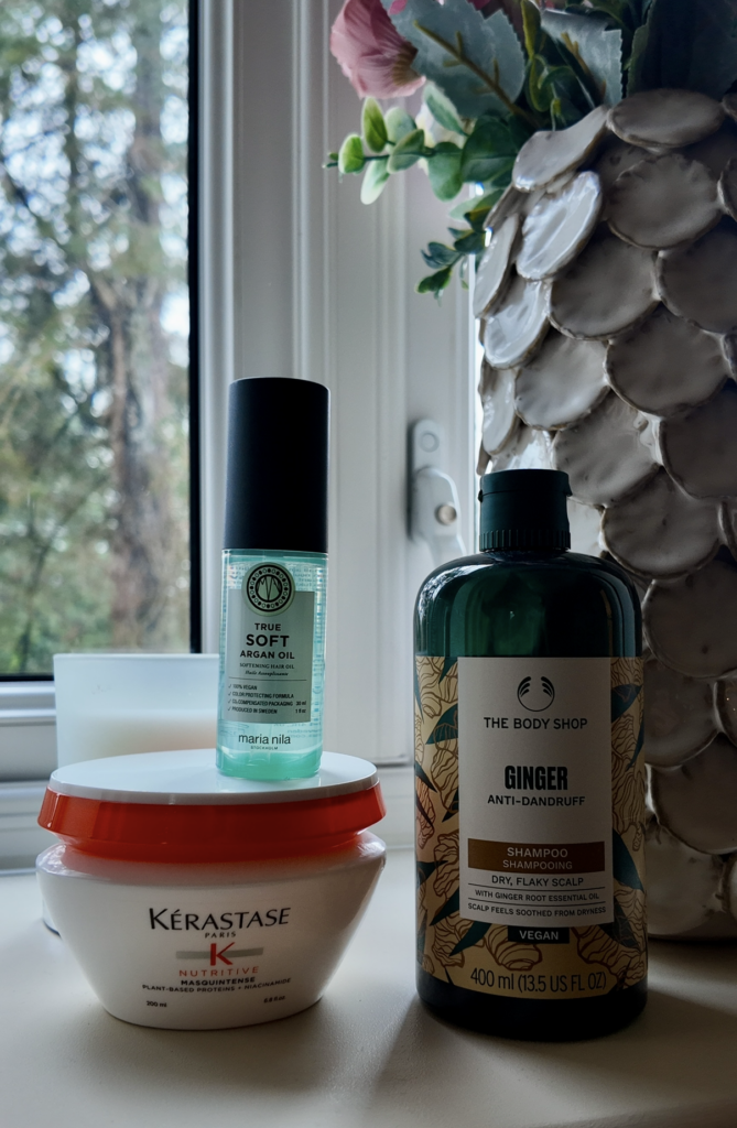 Three hair products , true soft argan oil, kerastase and body shop ginger shampoo